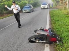 Wanita maut motosikal elak treler